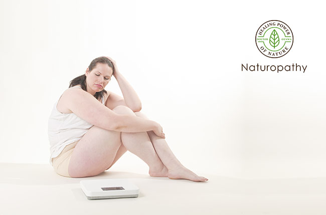 overweight woman and a scale-eyecatch