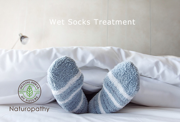 Female foot in warm Stripe wool sock ,Relaxing in bed concept